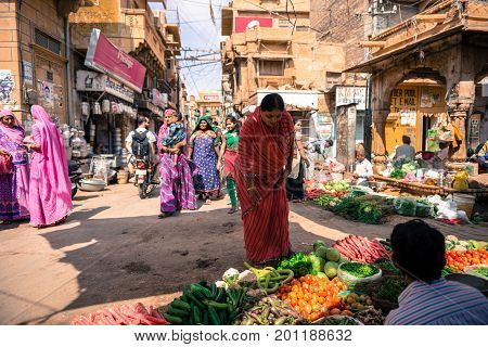 JAISALMER RAJASTHAN INDIA - MARCH 07 2016: Horizontal picture of indian people at the street market in Jaisalmer known as Golden City in India.