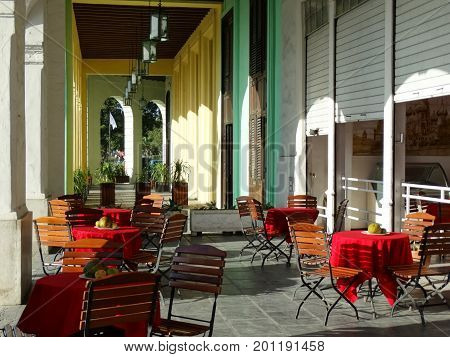 colorful walls and tables at an outdoor cafe