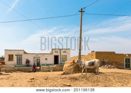 RAJASTHAN INDIA - MARCH 07 2016: Wide angle picture of traditional houses in Thar Desert located close to Jaisalmer the Golden City in India.