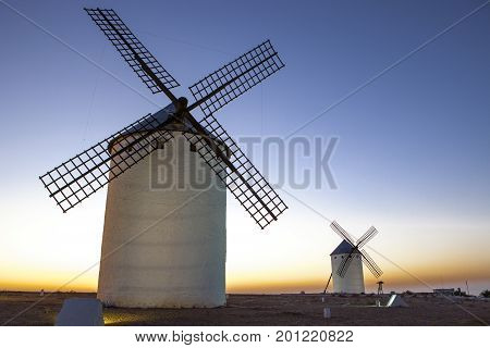 Illuminaed traditional windmills at rising Campo de Criptana Spain
