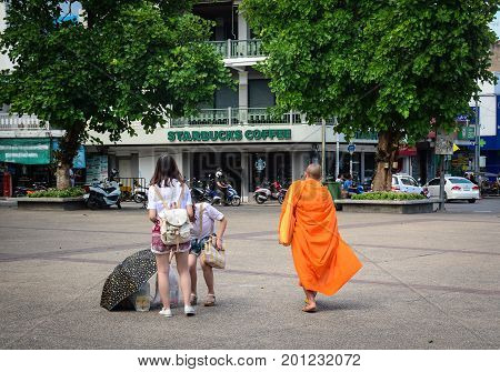 Buddhist Monks Walking On Street In Thailand