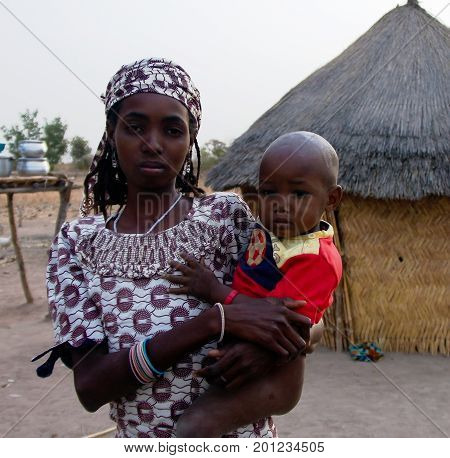 View to fulbe aka fulani tribe woman with child - 26-02-2014 Tchamba Cameroon