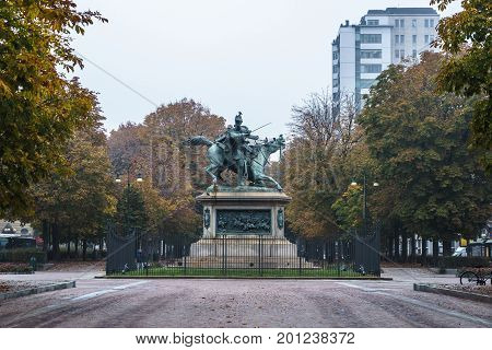 Landscape view of Turin with some trees and horse statue in autumn season