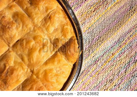 Freshly baked cheese pie on the table cloth