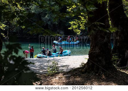 Adventure Team Doing Rafting Of The Voidomatis River In Zagori