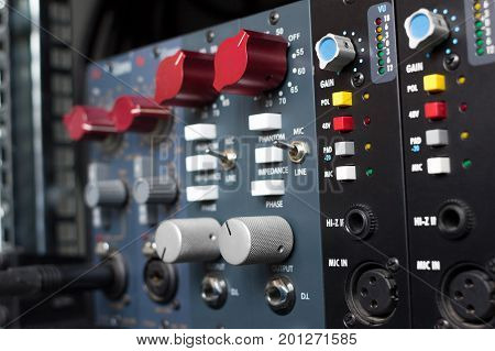 Microphone preamps for recording. Selective focus. Recording studio equipment.