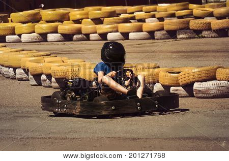 A Man Is Driving Go-kart With Speed In The Park