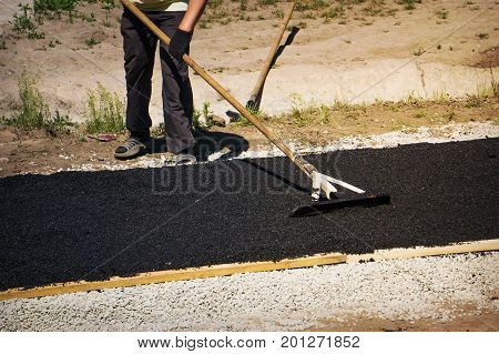 Levelling Fresh Asphalt On The Small Track
