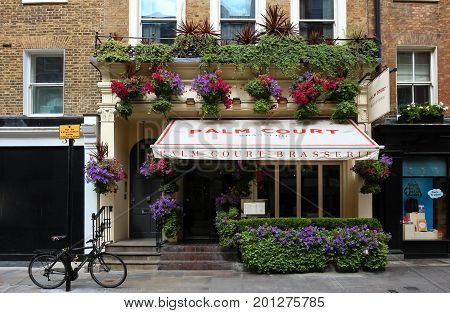 LONDON, ENGLAND-August 15, 2017: The exterior of Palm Court brasserie in the heart of Covent Garden , London, England. It is the quintessential, intimate Parisian-style brasserie.