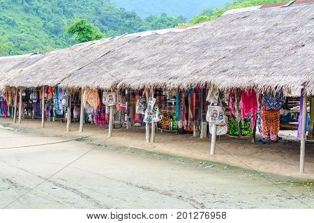 CHIANG MAI, THAILAND - July 10, 2017: Karen hill-tribe (Long Neck) woman weaving fabrics for a living at her house.