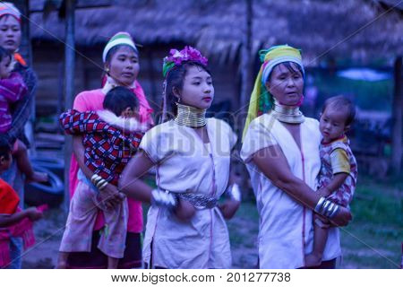 CHIANG MAI, THAILAND - July 10, 2017: Karen hill-tribe (Long Neck) woman weaving fabrics for a living at her house.