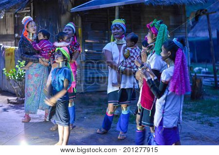 CHIANG MAI, THAILAND - July 10, 2017: Karen hill-tribe (Long Neck) woman weaving fabrics for a living at her house.