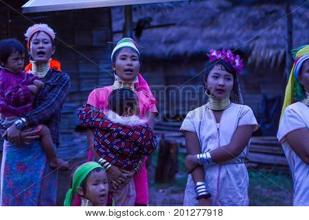 CHIANG MAI, THAILAND - July 10, 2017: Karen hill-tribe (Long Neck) woman weaving fabrics for a living at her house.