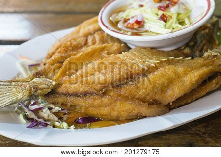 stir fried fish with rice and thai style sauce