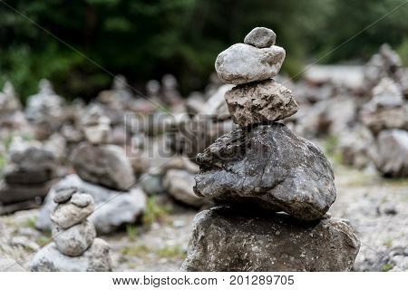 Stacks of stones on the riverside in Partnachklamm Garmisch-Partenkirchen Germany