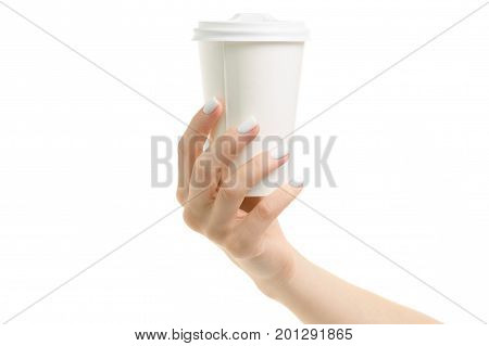 Female hands holding coffee in a cardboard glass on a white background isolation