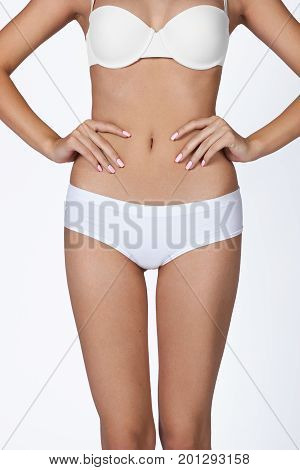 health and beauty - woman in cotton underwear showing slimming concept