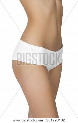 Slim tanned woman's body isolated over white background.