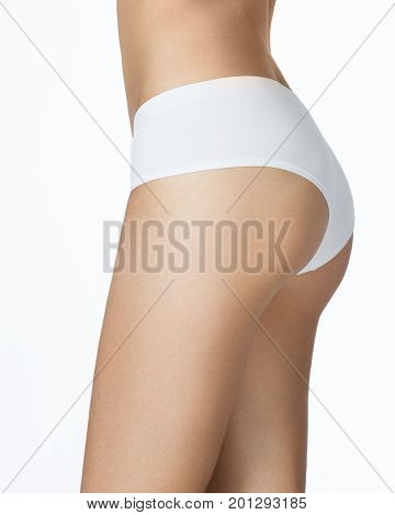 Slim tanned woman's body. Isolated over white background.