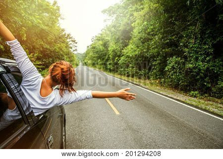 Asian women travel relax in the holiday. driving a car traveling happily.
