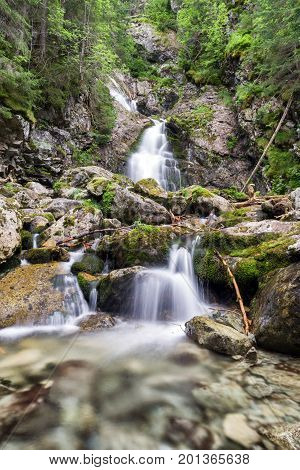 Waterfall in foresst - Kmetov vodopad in High tatras mountains Slovakia