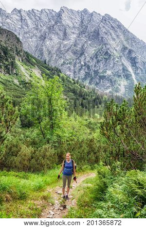 Happy hiker woman at valley Koprova dolina in High tatras mountains Slovakia