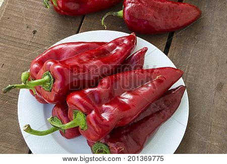 The most beautiful concept is Red fresh chilli on wood desk.