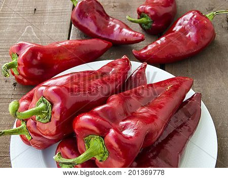 The most beautiful concept is Red fresh chilli on wood desk.