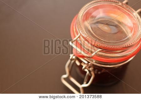 Jam in jar glass on black background