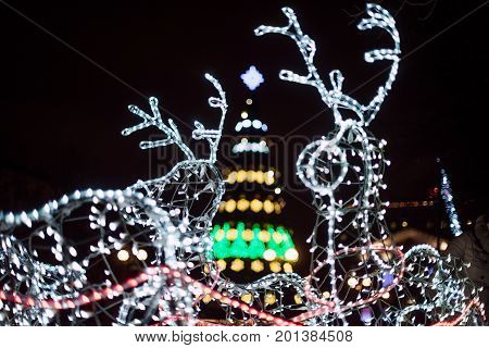 Lighting Decoration Deers With Christmas Tree On The Background In The City Of Gomel During New Year