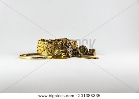 Luxurious And Expensive Golden Bracletes, Rings And Coin. Luxury Jewellery