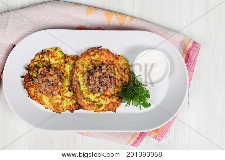 Draniki with mushroom caviar filmed in decor