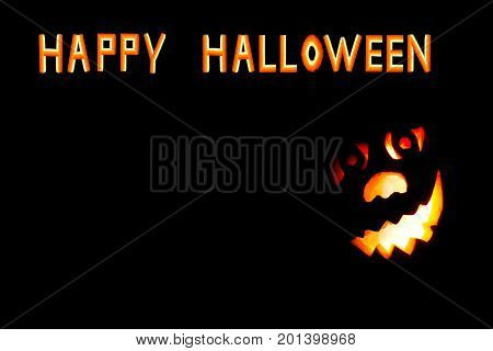 HappyHalloween pumpkin with scary face on black backgound