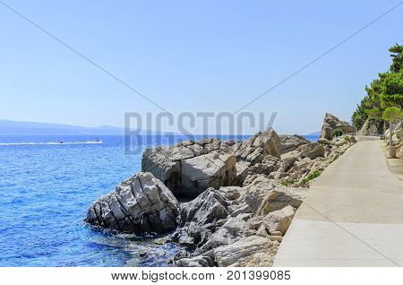 Concrete path by the sea. Photographed in the summer.