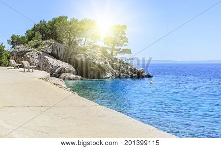 Concrete path by the sea. Photographed in the summer.