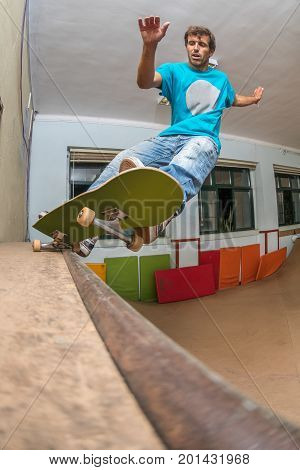 Skateboarder Performing A Pivot Grind