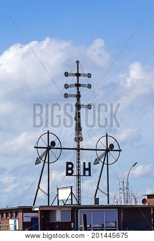 old wind semaphor for ships shows weather information in the North Sea this landmark of Cuxhaven Germany is the last original installation in Europe blue sky with clouds vertical