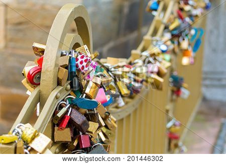 Wedding tradition symbol of love and fidelity closed castle on the railing of the bridge
