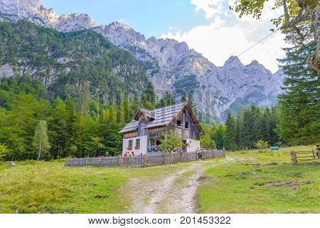 Mountain cabin, hut in European Alps, located in Robanov kot, Slovenia, popular hiking and climbing place with picturescue view