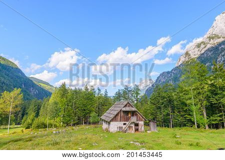 Mountain cabin, hut in European Alps, located in Robanov kot, Slovenia, popular hiking and climbing place with picturescue view