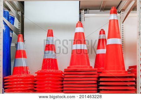 Row of Traffic safety cones ; road safety plastic cones on shelf