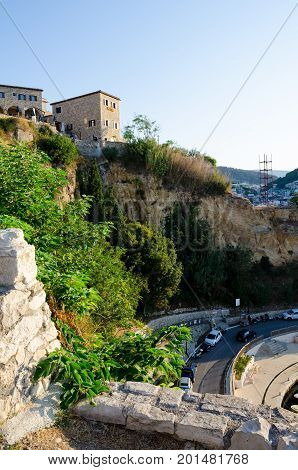 ULCINJ, MONTENEGRO - AUGUST 1, 2017: The wall of Stari Grad - old town of Ulcinj, Montenegro. City and central beach Mala Plaza on background.