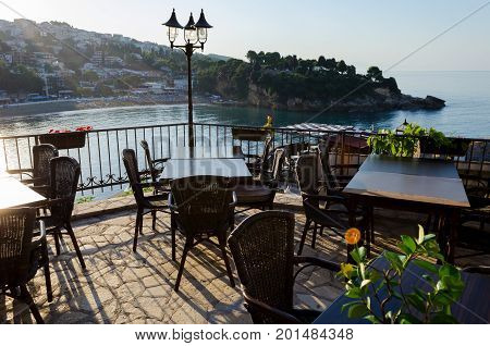 Cafe with beautiful sea view serving the local cuisine. Cozy bar restaurant at the old town of Ulcinj, Montenegro.