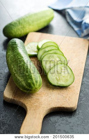 Sliced green cucumbers. Cucumbers on cutting board.