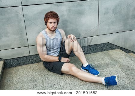 Athlete tired. Looking at camera seriosly. Outdoor
