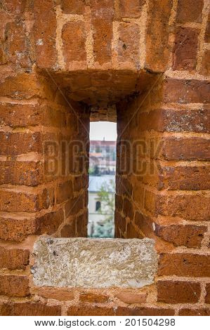 Krakow/Poland- August 14, 2017: Wawel Royal Castle, closeup arrowslit of defensive fortification wall