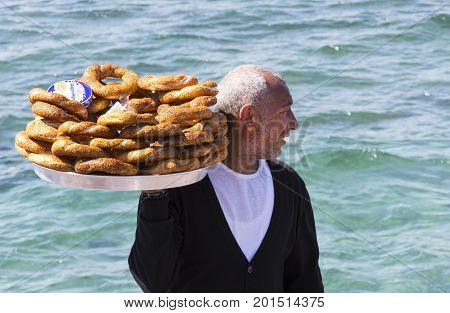 ISTANBUL, TURKEY - 1 APRIL , 2017:Street sales of traditional Turkish bagels Simit, are on the streets of Istanbul in Turkey