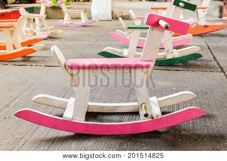 Colorful vintage rocking horse wooden chair for children could enjoy Thailand.
