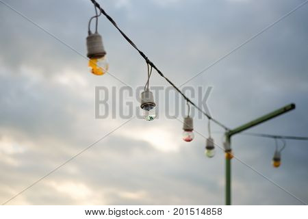 The Incandescent light bulbs in overcast sky with cloud.