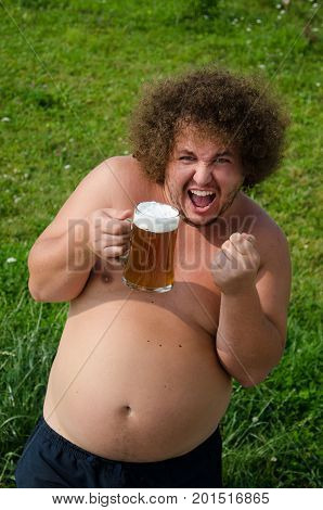 Fat man drinking beer. Funny naked guy.